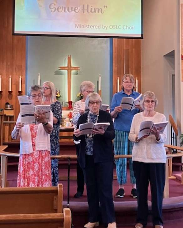A group of churchgoers sing hymns