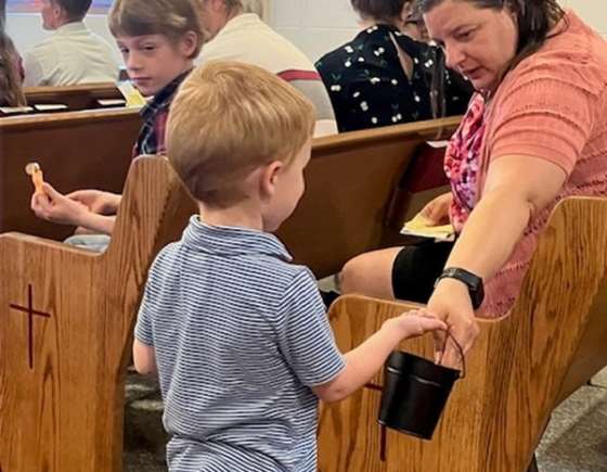 A child participates in church service