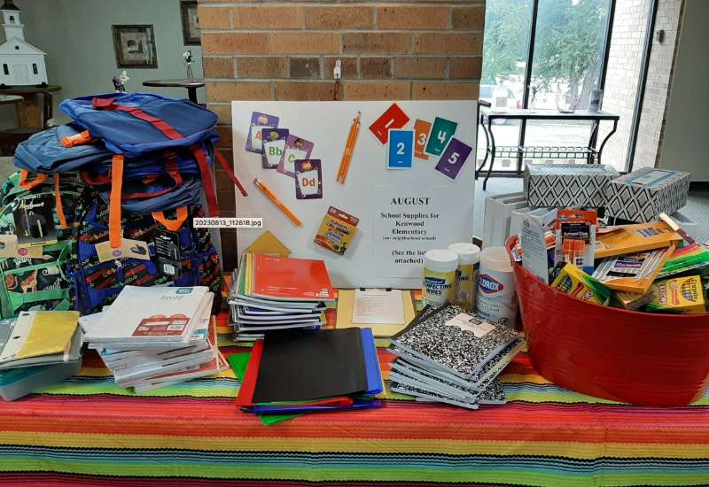 Donated school supplies on a table 