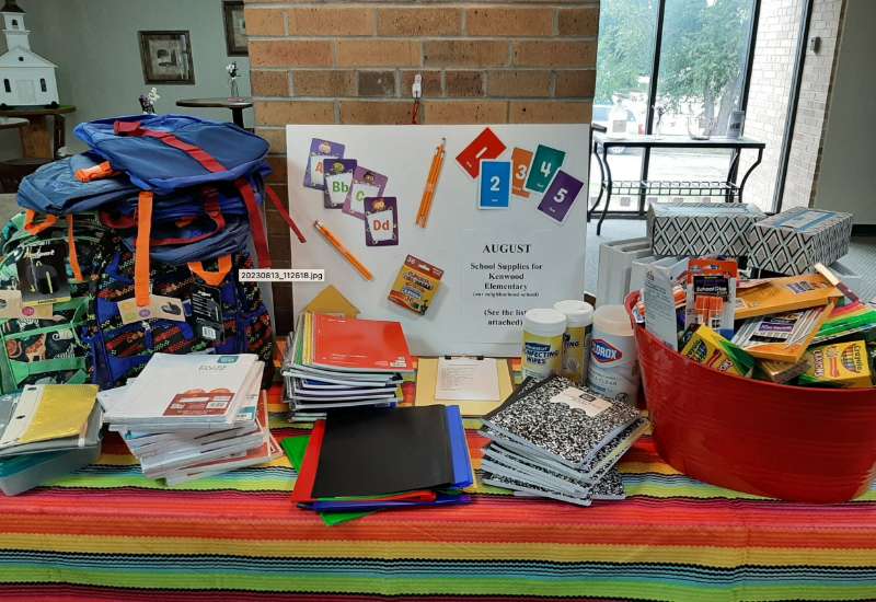 Donated school supplies on a table
